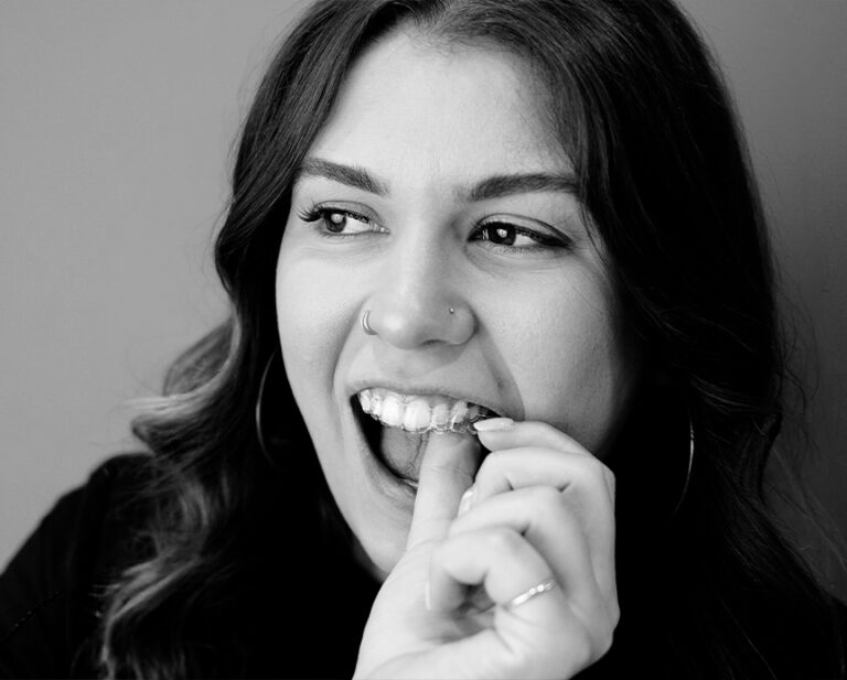 smiling girl wearing clear aligner